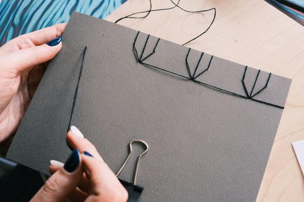 How can tourists find interactive workshops on traditional British bookbinding techniques?